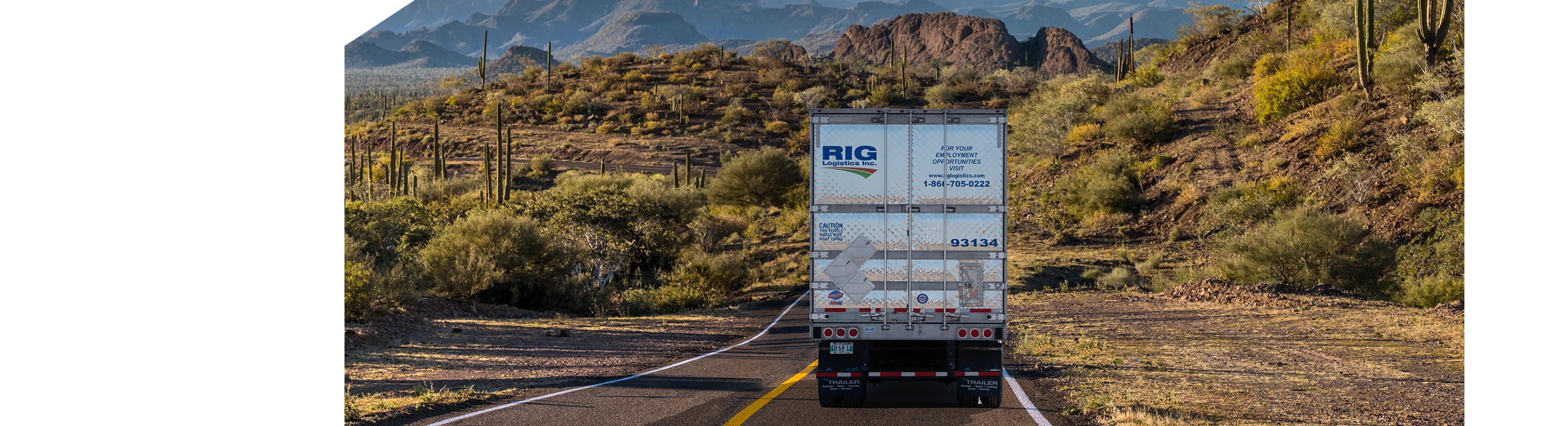 Back of RIG Logistics temperature controlled truck and trailer driving through Mexico landscape